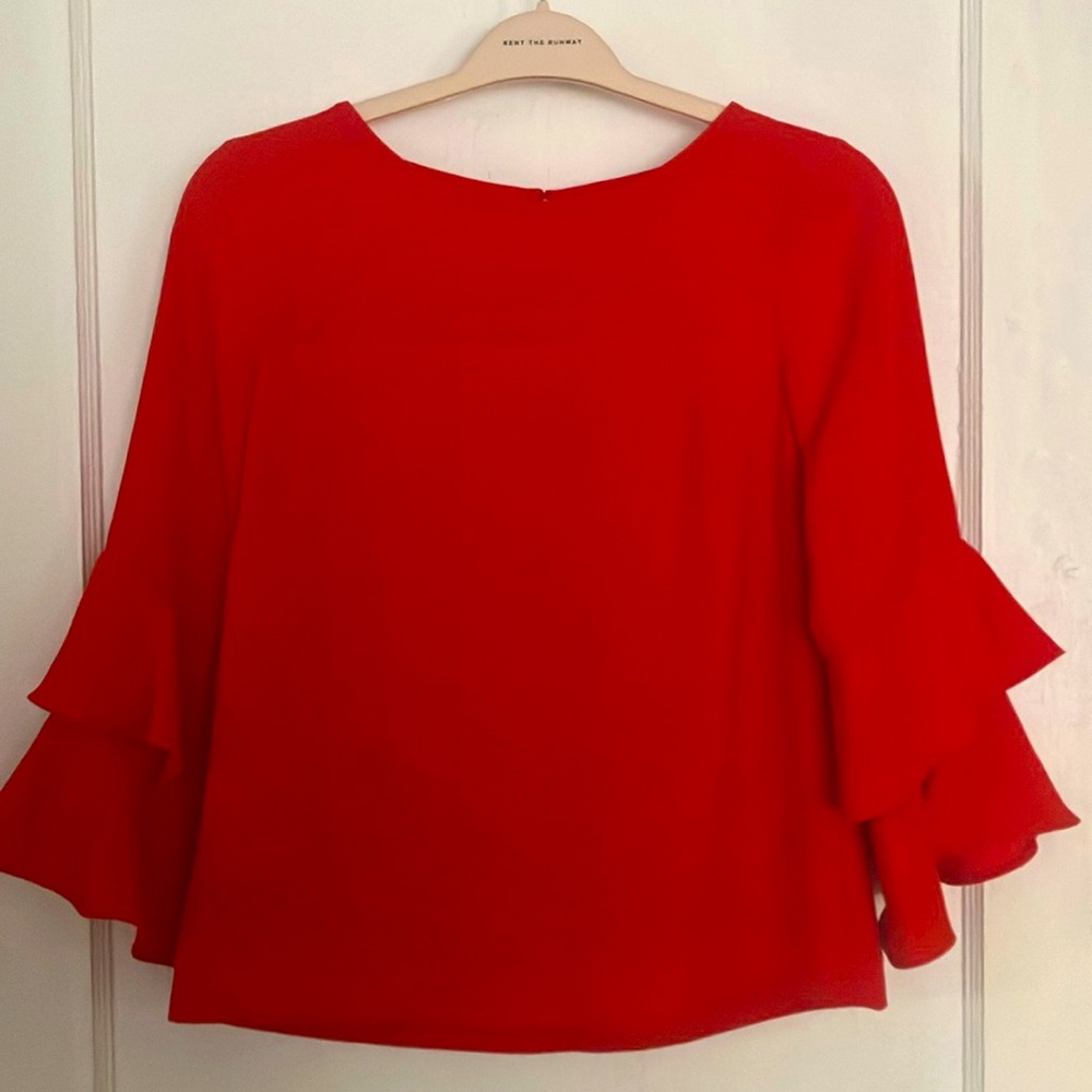 J. Crew Orange/Red Top. 3/4 length fluted sleeves. Excellent condition. Size 4.